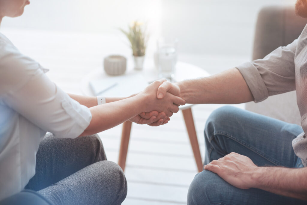 Pleasant friendly people shaking hands